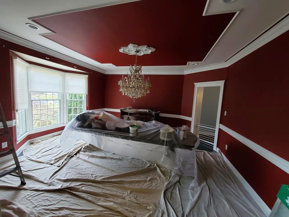 Elegant red formal dining room with crystal chandelier